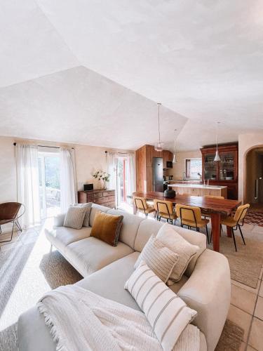 a living room with a couch and a table at Just Like Home - Casa da Raposa in Caminha