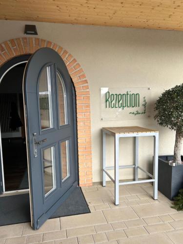 a door and a sign on the side of a building at Aparthotel Bad Radkersburg in Bad Radkersburg