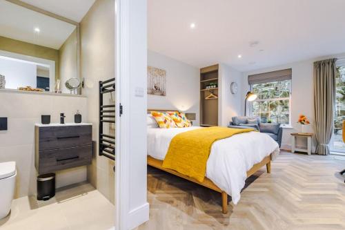 a bedroom with a bed and a bathroom at No.6 - Studio Apartment with Private Terrace in Stoney Middleton