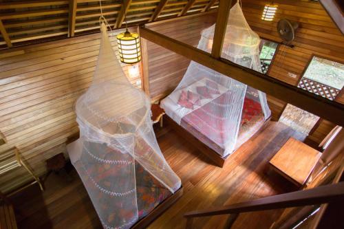 an overhead view of a room with a bed in a cabin at Sabai Corner Bungalows - SHA Extra Plus in Ko Yao Noi