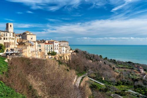a town on a hill next to the ocean at Casa Zaccardi in Vasto