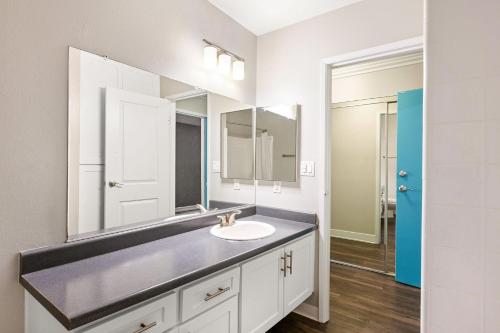 a bathroom with a sink and a mirror at Modern and Stylish Studio at 1200 Riverside in Burbank in Burbank