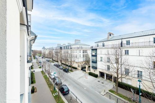 a view of a street in a city with buildings at *SPACIOUS APARTMENT DISNEYLAND PARIS* in Serris