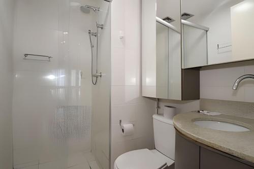 a bathroom with a shower and a toilet and a sink at Hotel Vision Brasília - Ozped Flats in Brasília