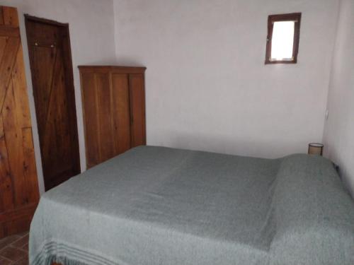 Ένα ή περισσότερα κρεβάτια σε δωμάτιο στο Cabañas del Monte