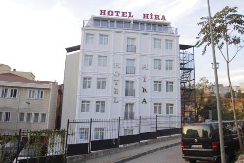 a white building with a sign on top of it at Hira Hotel in Istanbul