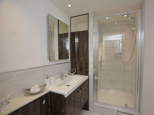 a bathroom with a sink and a shower at Home from Home - Greenwich House in Chester