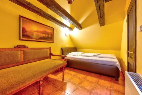 Ένα ή περισσότερα κρεβάτια σε δωμάτιο στο Betlem Club Hotel