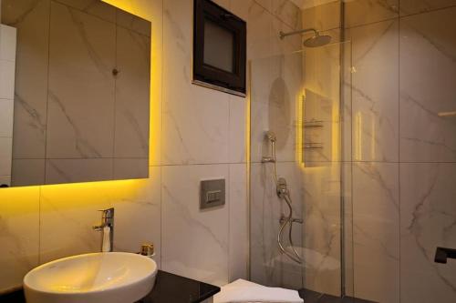 a bathroom with a sink and a shower at Villa Serengeti / Kalkan in Kaş