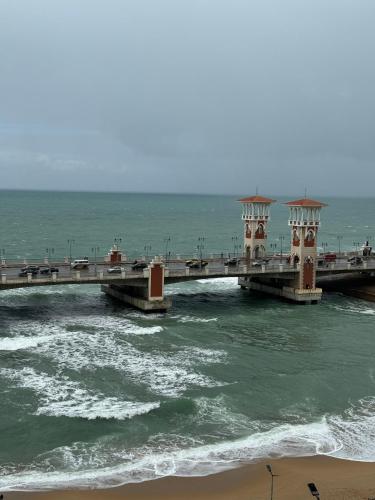 a bridge over the ocean with cars on it at Hyat Apartments in Alexandria