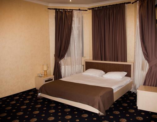 a hotel room with a bed and a window at Gonchar Hotel in Kyiv