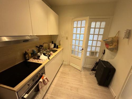 a kitchen with a sink and a counter top at Voske2 in Ghent