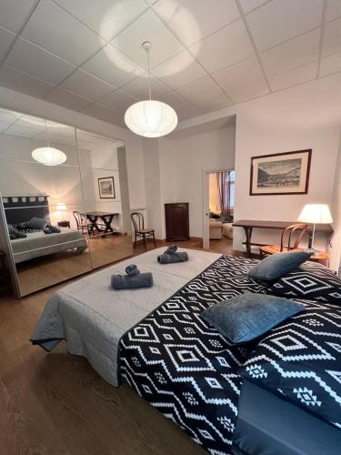 a bedroom with a large bed with two pillows on it at Loft in centro con parcheggio in Trieste