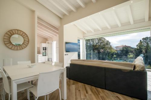 a bedroom with a bed and a table and a window at Villa Margidore in Lacona