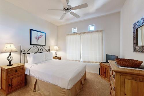 a bedroom with a large bed and a ceiling fan at Rancho Vistoso #256 in Tortolita