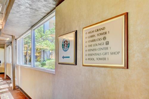 a picture on a wall with a sign on it at Strip View Suites - No Resort Fee ! in Las Vegas