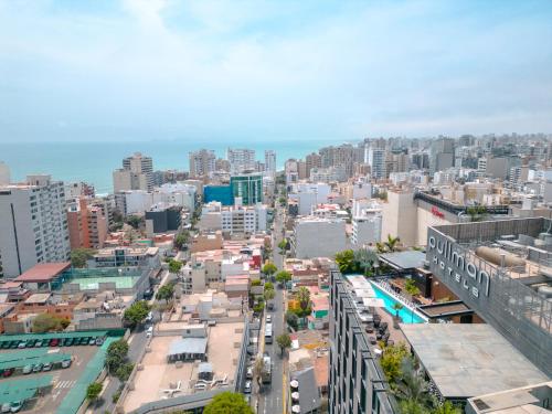 an aerial view of a city with tall buildings at Pullman Lima Miraflores in Lima
