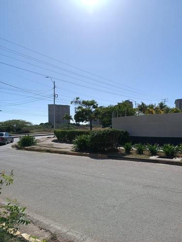 an empty street in a city with a building at LagunaSuite & More in Porlamar