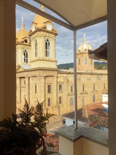 a large stone building with a clock tower at Apartamento con espectaculares vistas en el centro histórico in Socorro