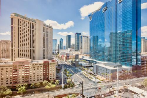 a city skyline with tall buildings and a highway at Strip View Suites - No Resort Fee ! in Las Vegas