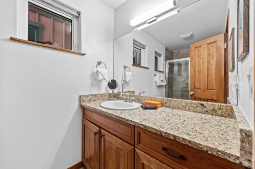 a bathroom with a sink and a mirror at 539 Granite St in Frisco