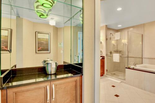 a bathroom with a shower and a sink at Strip View Suites - No Resort Fee ! in Las Vegas