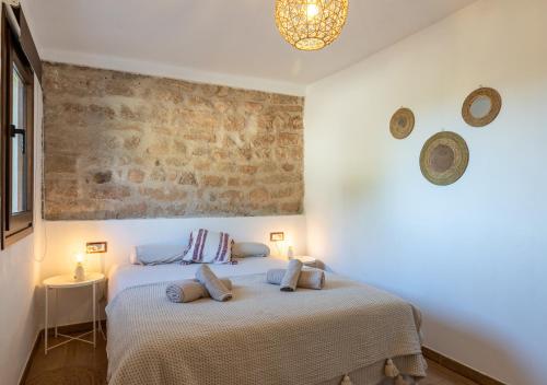 Postel nebo postele na pokoji v ubytování Masia Aubareda