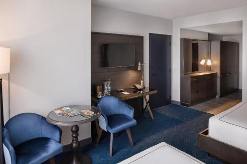 Postel nebo postele na pokoji v ubytování Hotel Van Zandt