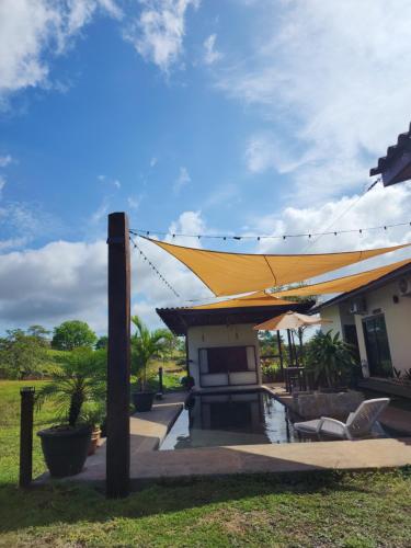 a building with a yellow tent over it at Catalina Cabins in Santa Catalina