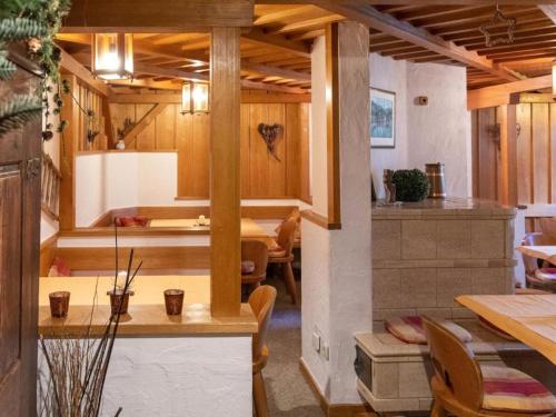 a kitchen and dining room with a table and chairs at Alpinechalet Zigjam in Gaschurn
