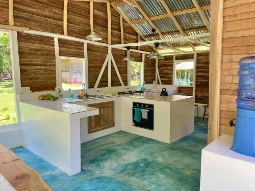 a kitchen with an underwater floor in a house at Rancho Romana Retreat N-05 in El Limón