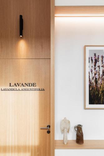 a door with a sign on it in a room at Le Couvent des Minimes, un Hôtel & Spa L'Occitane en Provence in Mane