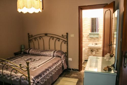 a bedroom with a bed and a sink and a window at Brother's Home in Civitella Casanova