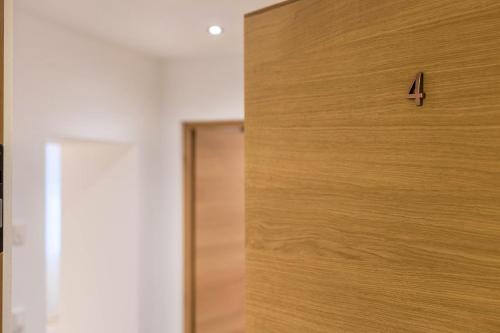 a close up of a wooden door in a room at Mountain Meadows Apt 4 in Valdaora