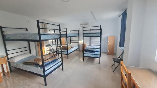 Postel nebo postele na pokoji v ubytování ALBERGUE LA TIÑOSA