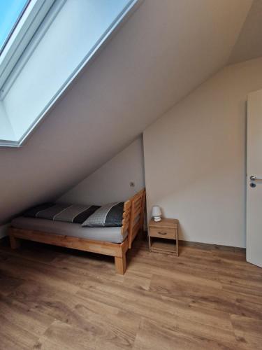 a bedroom with a bed in a attic at Haus Grimming in Öblarn