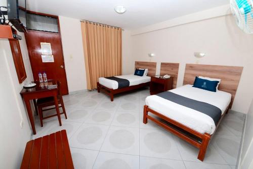 Postel nebo postele na pokoji v ubytování Hotel Santa Rosa