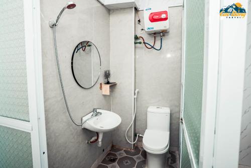 a bathroom with a shower and a toilet and a sink at Cốm Homestay Cao Bằng in Cao Bằng