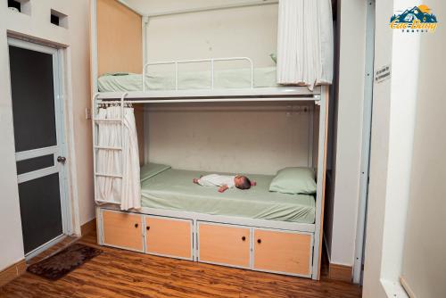 a bedroom with two bunk beds in a room at Cốm Homestay Cao Bằng in Cao Bằng