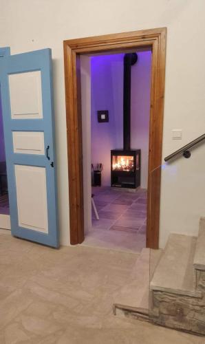 a view of a room with a fireplace at 7Kamares in Pano Lefkara