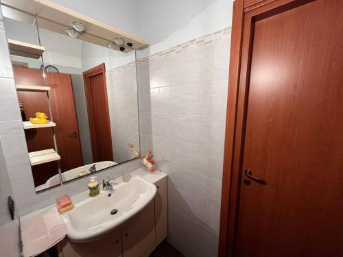 a bathroom with a sink and a mirror at “Corona Grossa” - due posti letto - A in Brusasco