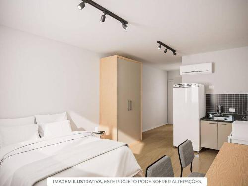 a bedroom with a large bed and a kitchen at Apt. inteiro recém-reformado - Vila Clementino in Sao Paulo