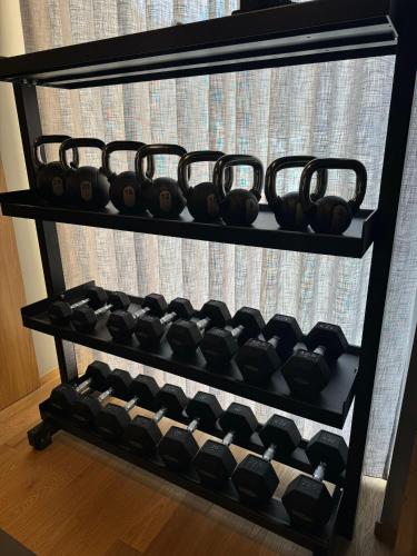 a rack of wine bottles on a shelf at Best Western Plus Hotel Plaza in Naples