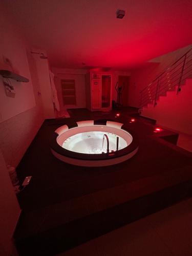 a bathroom with a large tub with a red light at SAN NICOLA LUXURY in Bari