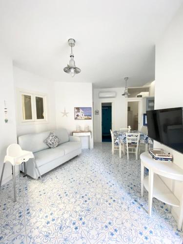 a living room with a couch and a table at Arime Apartment in Ischia