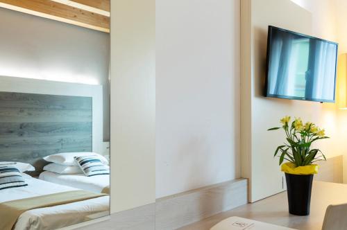 Postel nebo postele na pokoji v ubytování Hotel Alexander
