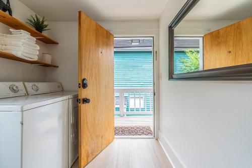 a kitchen with a washer and dryer and a window at Capitol Hill Cutie in Seattle