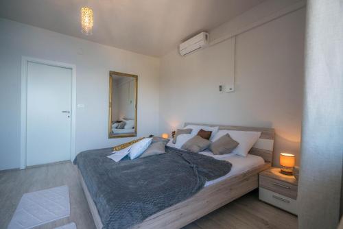 Postel nebo postele na pokoji v ubytování Apartments Sonata