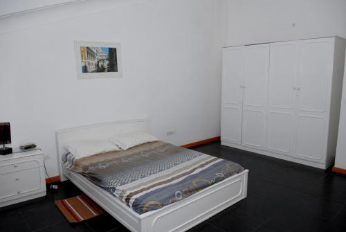 Кровать или кровати в номере Apartamentos Santiago - Praia