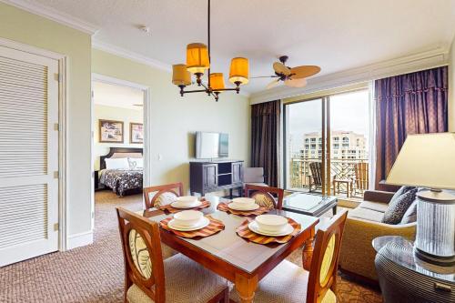 a living room with a table with chairs and a room at Sandpearl unit 757 in Clearwater Beach